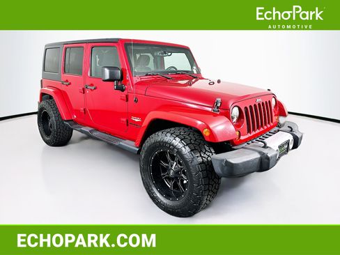 Used 2013 Jeep Wrangler Unlimited Sahara w/ Dual Top Group AWD/4WD image 1