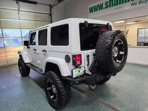Used 2013 Jeep Wrangler Unlimited Sahara w/ Dual Top Group AWD/4WD image 9
