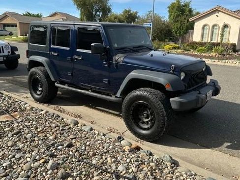 Used 2013 Jeep Wrangler Unlimited Sport image 1