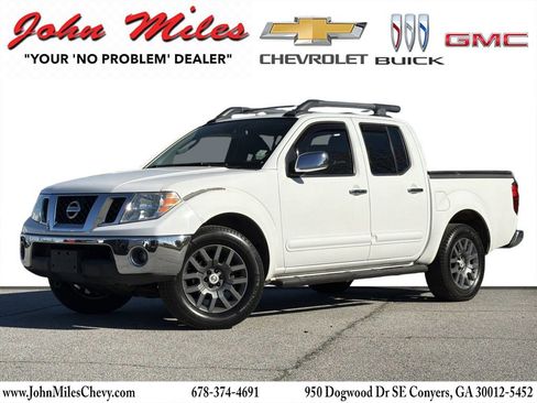 Used 2011 Nissan Frontier SL AWD/4WD image 1