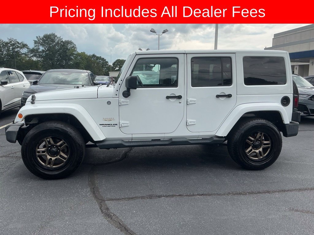 Used 2013 Jeep Wrangler Unlimited Sahara w/ Dual Top Group AWD/4WD image 2