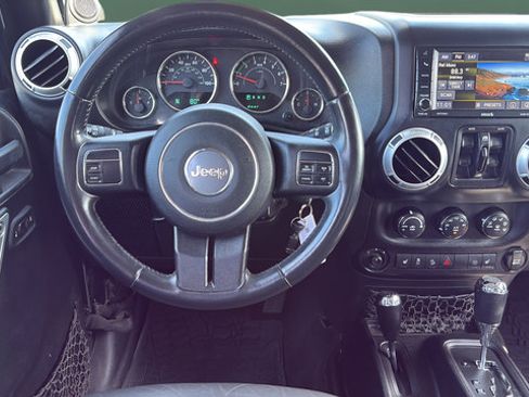 Used 2014 Jeep Wrangler Unlimited Sahara w/ Dual Top Group AWD/4WD image 25