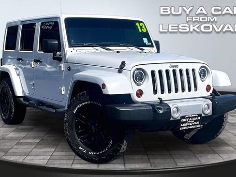Used 2013 Jeep Wrangler Unlimited Sahara w/ Connectivity Group AWD/4WD image 1