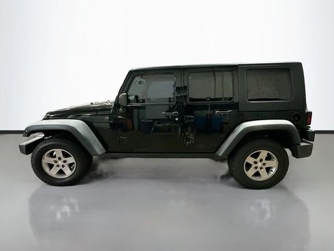 Used 2010 Jeep Wrangler Unlimited Rubicon w/ Dual Top Group image 9