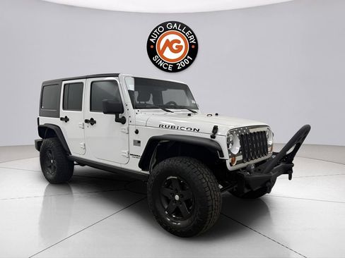 Used 2012 Jeep Wrangler Unlimited Rubicon w/ Dual Top Group AWD/4WD image 1