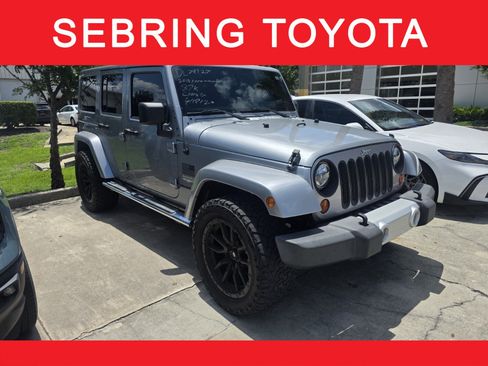 Used 2013 Jeep Wrangler Unlimited Sahara w/ Dual Top Group AWD/4WD image 1