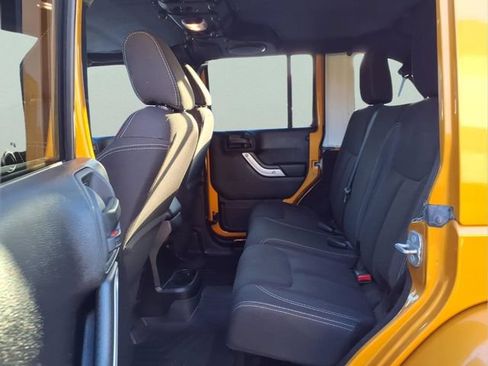 Used 2014 Jeep Wrangler Unlimited Sahara w/ Dual Top Group AWD/4WD image 16