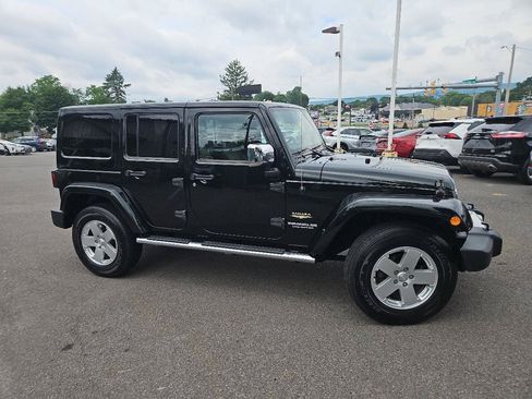 Used 2012 Jeep Wrangler Unlimited Sahara w/ Dual Top Group AWD/4WD image 2