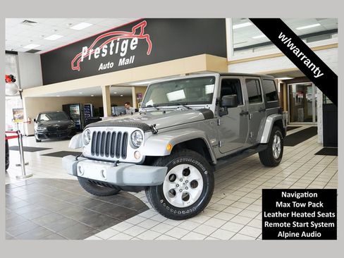 Used 2014 Jeep Wrangler Unlimited Sahara w/ Dual Top Group AWD/4WD image 1