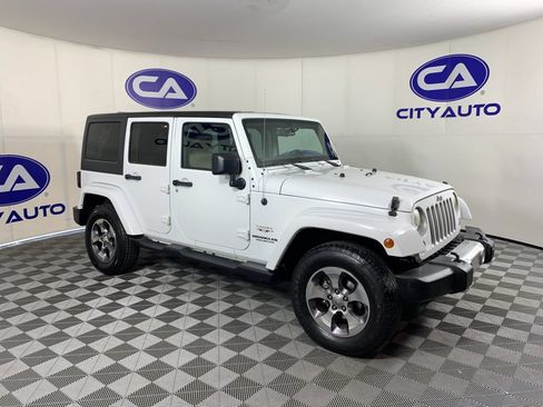 Used 2016 Jeep Wrangler Unlimited Sahara w/ Dual Top Group AWD/4WD image 1