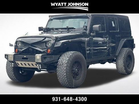 Used 2012 Jeep Wrangler Unlimited Sahara w/ Dual Top Group AWD/4WD image 1