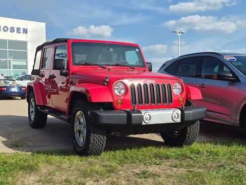 Used 2013 Jeep Wrangler Unlimited Sahara w/ Dual Top Group AWD/4WD image 1