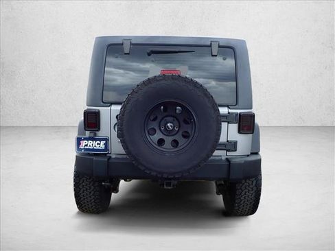 Used 2013 Jeep Wrangler Unlimited Sport w/ Mopar Black Appearance Group AWD/4WD image 3