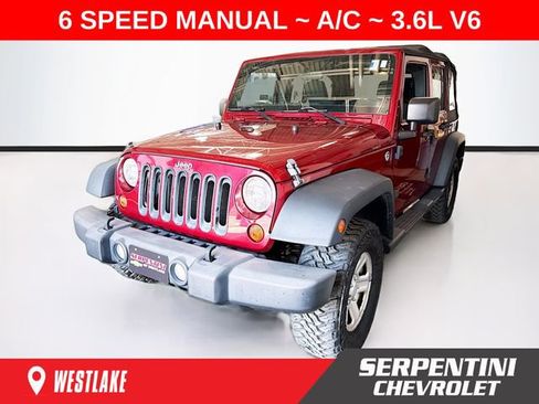 Used 2012 Jeep Wrangler Unlimited Sport AWD/4WD image 1
