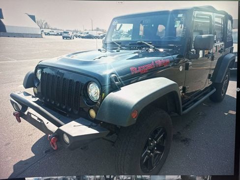 Used 2013 Jeep Wrangler Unlimited Sport image 1