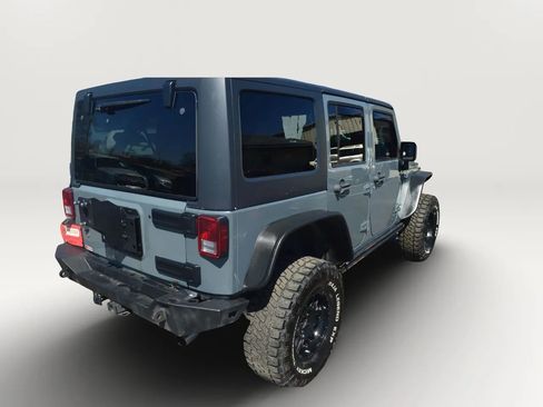 Used 2014 Jeep Wrangler Unlimited Rubicon w/ Dual Top Group AWD/4WD image 9