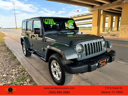 Used 2015 Jeep Wrangler Unlimited Sahara w/ Dual Top Group AWD/4WD image 1