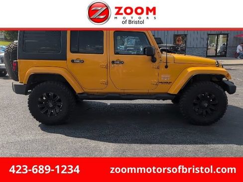 Used 2013 Jeep Wrangler Unlimited Sahara w/ Dual Top Group AWD/4WD image 1