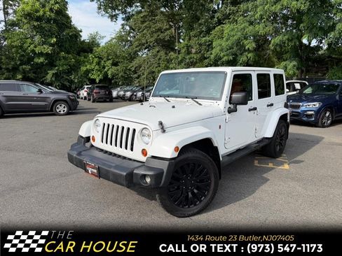 Used 2013 Jeep Wrangler Unlimited Sahara w/ Dual Top Group AWD/4WD image 1