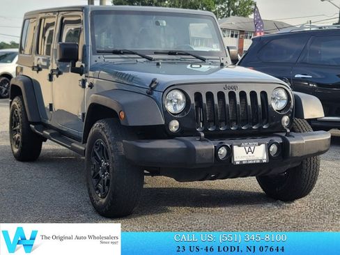 Used 2015 Jeep Wrangler Unlimited Sport w/ Dual Top Group AWD/4WD image 1
