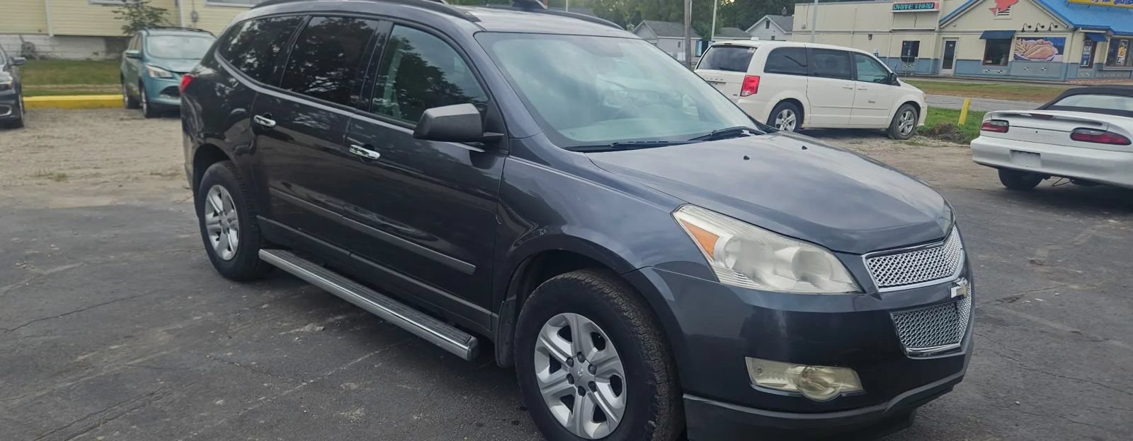Used 2012 Chevrolet Traverse LS w/ LPO, 'HIT The Road' Package FWD image 2