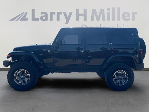 Used 2013 Jeep Wrangler Unlimited Rubicon w/ Dual Top Group AWD/4WD image 2