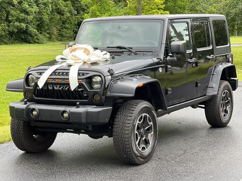 Used 2014 Jeep Wrangler Unlimited Sahara w/ Dual Top Group AWD/4WD image 1