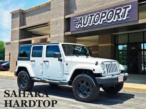 Used 2014 Jeep Wrangler Unlimited Sahara w/ Dual Top Group AWD/4WD image 1