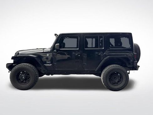 Used 2012 Jeep Wrangler Unlimited Sahara w/ Dual Top Group AWD/4WD image 2
