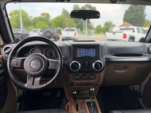 Used 2012 Jeep Wrangler Unlimited Sahara w/ Dual Top Group AWD/4WD image 11