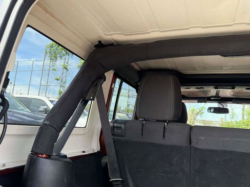 Used 2014 Jeep Wrangler Unlimited Sahara w/ Dual Top Group AWD/4WD image 6