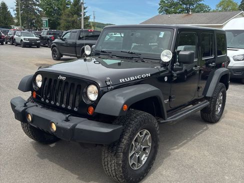 Used 2013 Jeep Wrangler Unlimited Rubicon w/ Dual Top Group AWD/4WD image 1