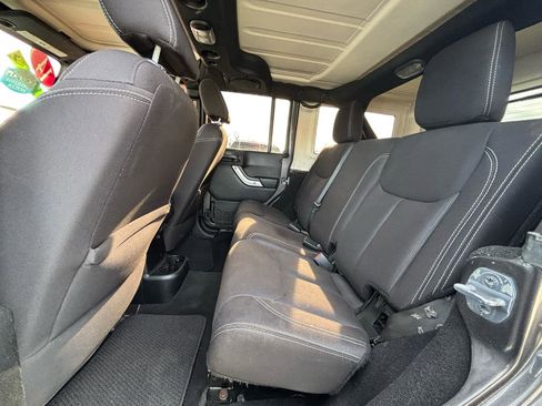 Used 2014 Jeep Wrangler Unlimited Sahara w/ Dual Top Group AWD/4WD image 14