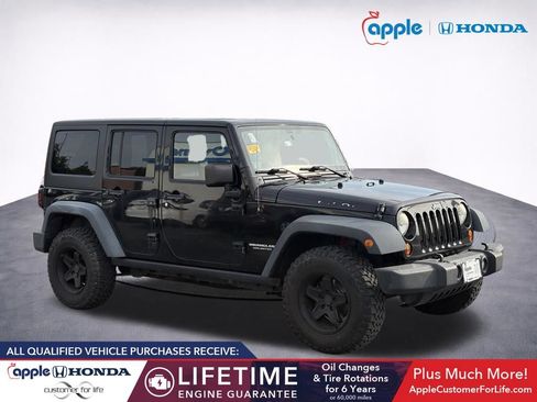 Used 2012 Jeep Wrangler Unlimited Rubicon w/ Dual Top Group AWD/4WD image 1