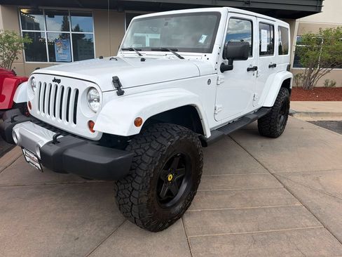 Used 2013 Jeep Wrangler Unlimited Sahara w/ Dual Top Group AWD/4WD image 2