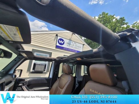 Used 2014 Jeep Wrangler Unlimited Sahara w/ Dual Top Group AWD/4WD image 13