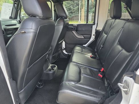 Used 2013 Jeep Wrangler Unlimited Sahara w/ Dual Top Group AWD/4WD image 16
