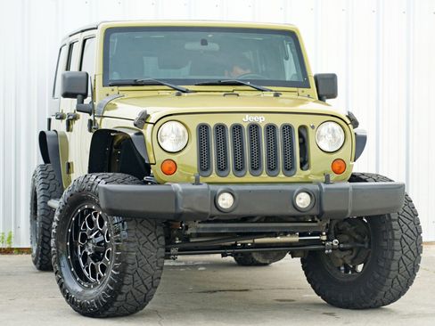 Used 2013 Jeep Wrangler Unlimited Sport w/ Mopar Black Appearance Group image 2