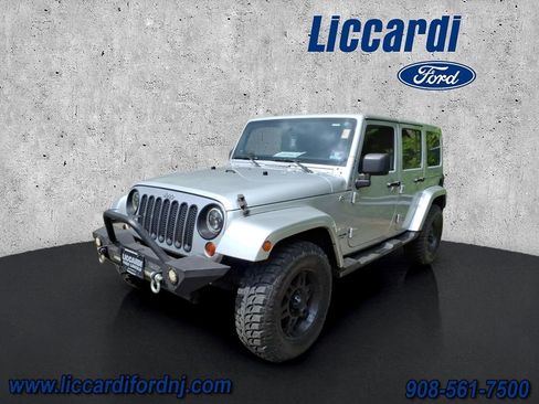 Used 2012 Jeep Wrangler Unlimited Sahara w/ Dual Top Group AWD/4WD image 3