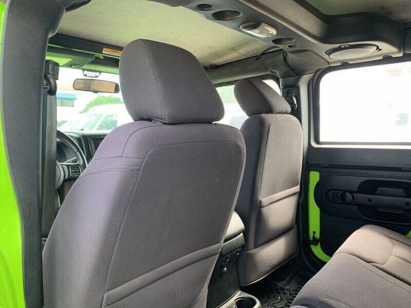 Used 2013 Jeep Wrangler Unlimited Sport w/ Mopar Black Appearance Group AWD/4WD image 16