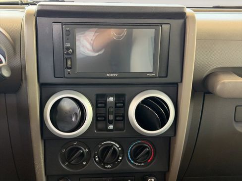 Used 2010 Jeep Wrangler Unlimited Sahara w/ Dual Top Group AWD/4WD image 16
