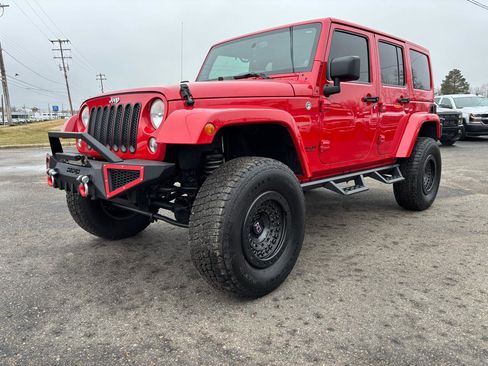 Used 2014 Jeep Wrangler Unlimited Sahara w/ Dual Top Group image 1