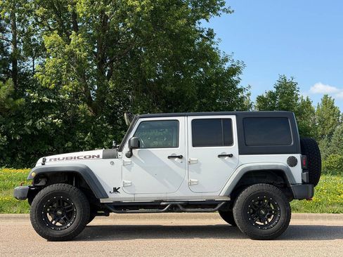 Used 2012 Jeep Wrangler Unlimited Rubicon w/ Dual Top Group AWD/4WD image 2