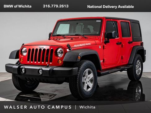 Used 2012 Jeep Wrangler Unlimited Rubicon w/ Dual Top Group AWD/4WD image 1