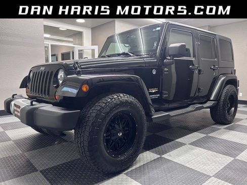 Used 2013 Jeep Wrangler Unlimited Sahara w/ Dual Top Group AWD/4WD image 1
