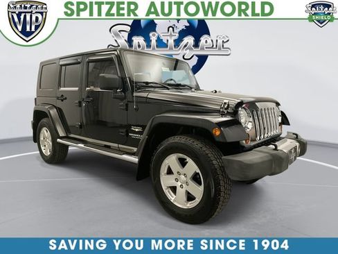 Used 2009 Jeep Wrangler Unlimited Sahara w/ Dual Top Group AWD/4WD image 1
