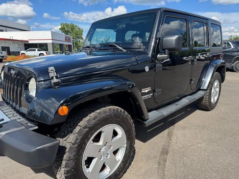 Used 2012 Jeep Wrangler Unlimited Sahara w/ Dual Top Group AWD/4WD image 9