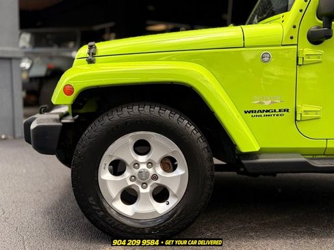 Used 2013 Jeep Wrangler Unlimited Sahara w/ Dual Top Group AWD/4WD image 12