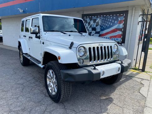 Used 2015 Jeep Wrangler Unlimited Sahara w/ Mopar Chrome Edition Group AWD/4WD image 1