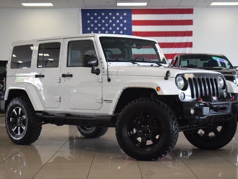 Used 2014 Jeep Wrangler Unlimited Sahara AWD/4WD image 1